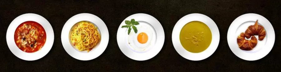 five white plates with different kinds of dishes
